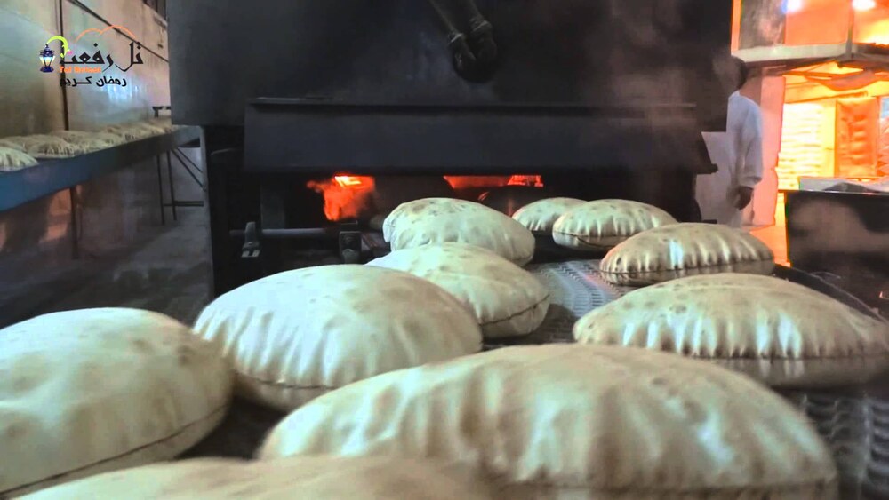 Puffed pita bread fresh from a hot bakery oven